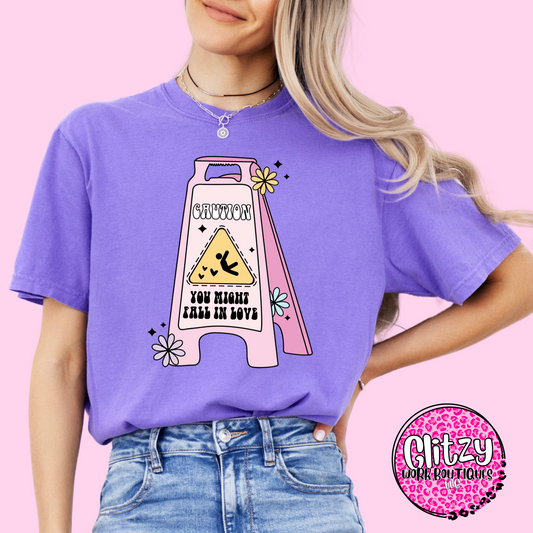 CAUTION YOU MIGHT FALL IN LOVE PRINTED APPAREL